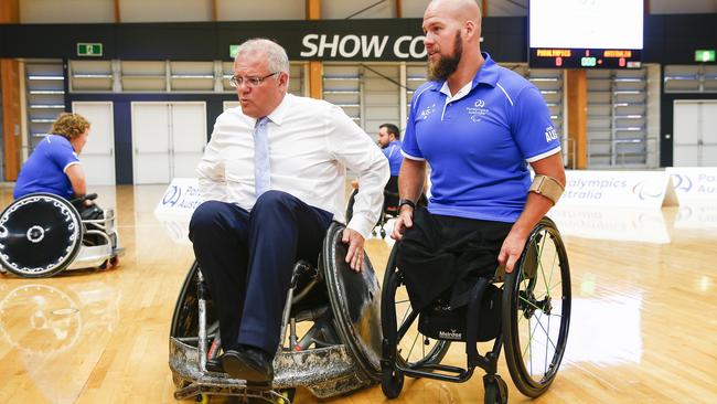 Scott Morrison with wheelchair rugby gold medallist Ryley Batt at Sydney Olympic Park yesterday. Picture: Dylan Robinson