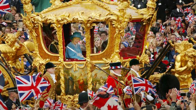 The Queen and Prince Philip ride in the Golden State Carriage at the head of a parade from Buckingham Palace to St Paul's Cathedral celebrating the Queen's Golden Jubilee in 2002. Picture: Getty Images.