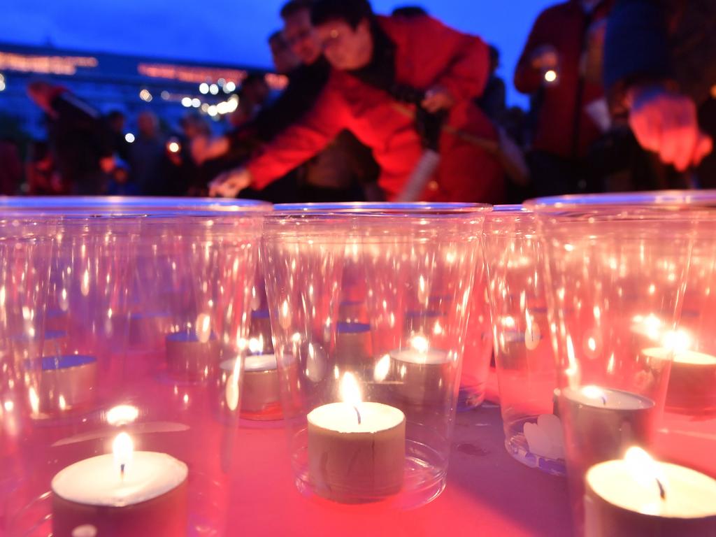 People light candles to after an anti—semitic shooting shocked Germany. Picture: AFP