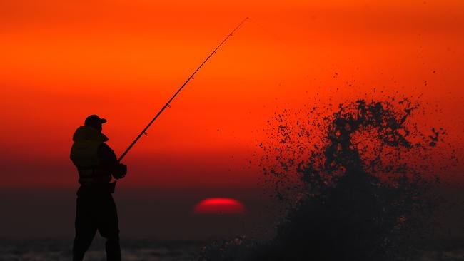 Smokey sunrise at Mona Vale beach in Sydney .Picture: John Grainger.