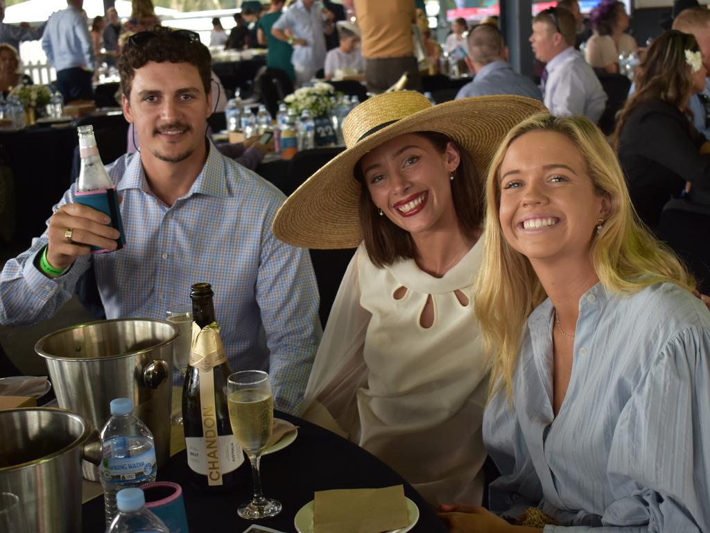 Boston Bobbert, Sarah Moller, and Holly Bartholomew at The Archer race meeting at Callaghan Park, Rockhampton, on May 7, 2022.