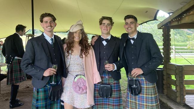 Robin Bailey and her sons Finn, 23 Lewin, 21 and Piper, 18 attending a wedding in Scotland in August. Photo: Facebook.