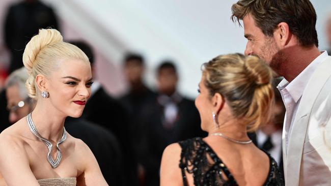 Australian actor Chris Hemsworth (R) Spanish actress Elsa Pataky (C) and British-US actress Anya Taylor-joy arrive for the screening of the film "Furiosa: A Mad Max Saga" at the 77th edition of the Cannes Film Festival. Picture: AFP