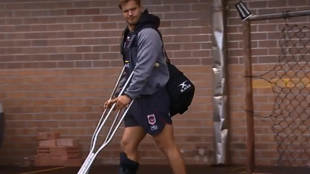 Jack De Belin leaves the Dragons team facility on crutches and wearing a moon boot.
