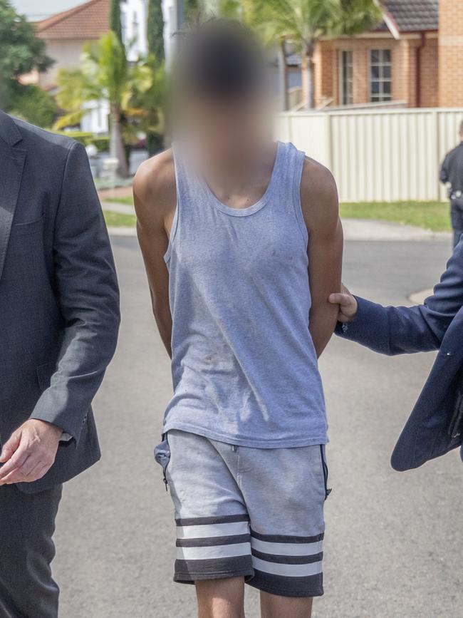 One of the teenagers allegedly involved in the plot being arrested in Sydney. Picture: NSW Police