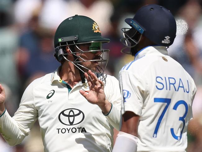 ADELAIDE, AUSTRALIA - DECEMBER 08: Travis Head of Australia talks with Mohammed Siraj of India during day three of the Men's Test Match series between Australia and India at Adelaide Oval on December 08, 2024 in Adelaide, Australia. (Photo by Paul Kane/Getty Images)