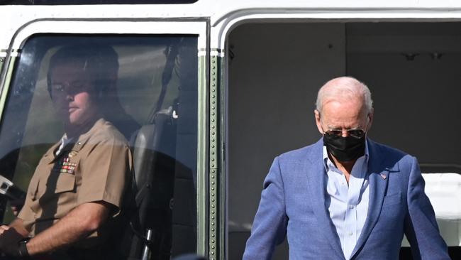 Joe Biden disembarks from Marine One as he arrives at the Delaware Air National Guard base in New Castle, on Saturday. Picture: AFP