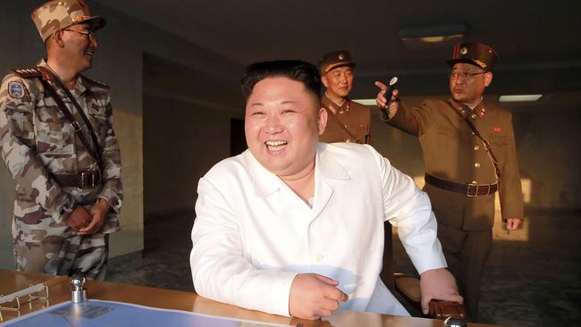 North Korean leader Kim Jong-Un inspects the test-fire of a ballistic missile at an undisclosed location in North Korea, according to the country’s state media agency. Picture: AFP