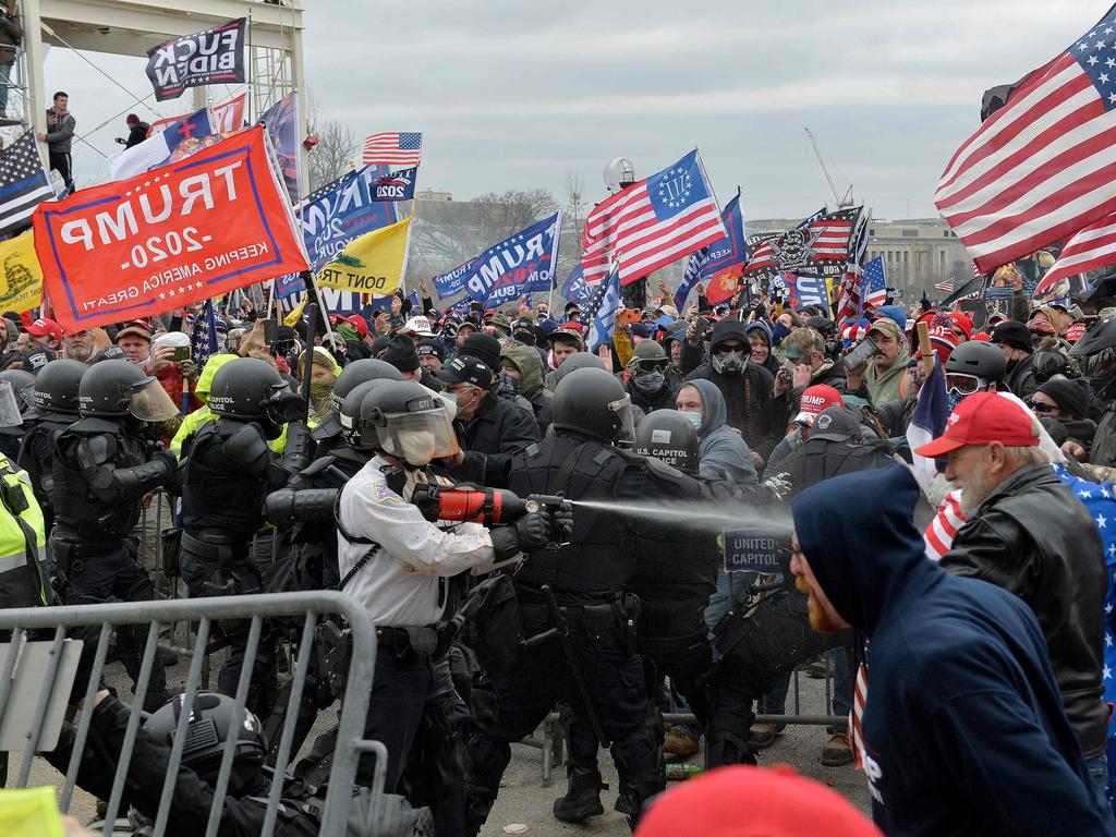 Trump supporters clash with police and security forces as they try to storm the US Capitol in Washington, DC. Picture: AFP