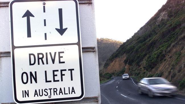 A road safety sign on the Great Ocean Road at Lorne advising tourists to drive on the left.