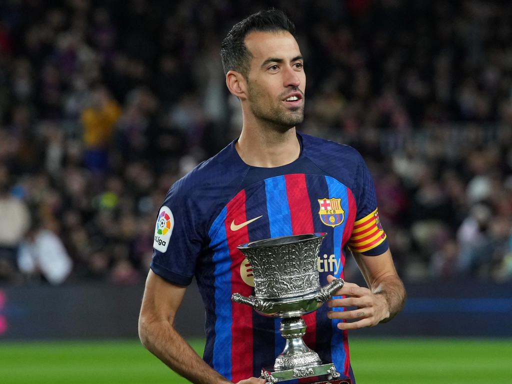 BARCELONA, SPAIN - JANUARY 22: Sergio Busquets of FC Barcelona presents the Spanish Supercopa Trophy to the fans prior to the LaLiga Santander match between FC Barcelona and Getafe CF at Spotify Camp Nou on January 22, 2023 in Barcelona, Spain. (Photo by Alex Caparros/Getty Images)