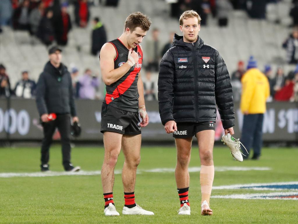 Darcy Parish (right) with Zach Merrett during last week’s loss to Carlton. Picture: Michael Willson/AFL Photos via Getty Images.