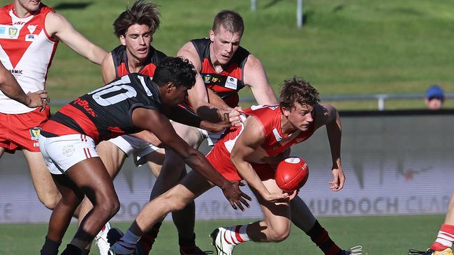 Clarence’s Oscar Paprotny is tackled by three Lauderdale players in a TSL match at Blundstone Arena last year. The Roos are unable to play at their home ground in 2020. Picture: LUKE BOWDEN