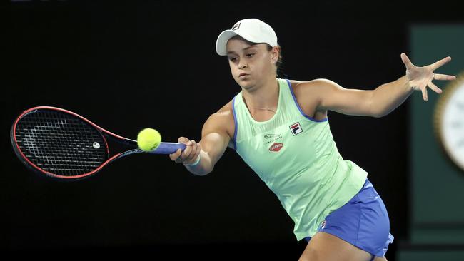 Australia's Ashleigh Barty makes a forehand return to Lesia Tsurenko of Ukraine during their first round singles match at the Australian Open. Picture: AP