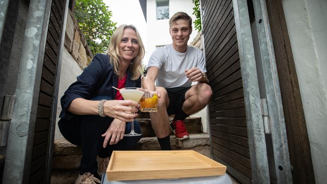 Cheers! Julie Cross and son Charlie enjoying cocktails during the coronavirus pandemic. Picture: Julian Andrews.