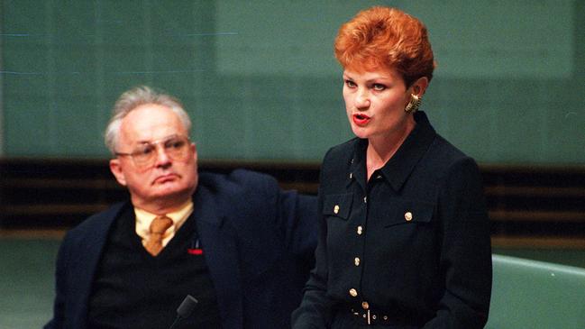 Pauline Hanson delivers her maiden speech in the House of Representatives in September 1996, with fellow Independent Graeme Campbell looking on. Picture: Michael Jones.