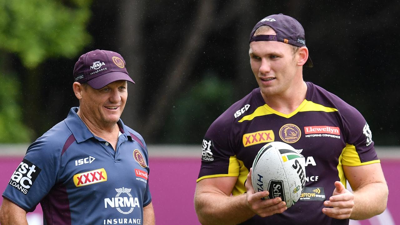 Assistant coach Kevin Walters (left) is seen with Matt Lodge (right) during a Brisbane Broncos training session at Clive Berghofer Field in Brisbane, Wednesday, March 7, 2018. The Broncos play the St George-Illawarra Dragons in the opening match of the 2018 NRL season on Thursday night in Sydney. (AAP Image/Darren England) NO ARCHIVING