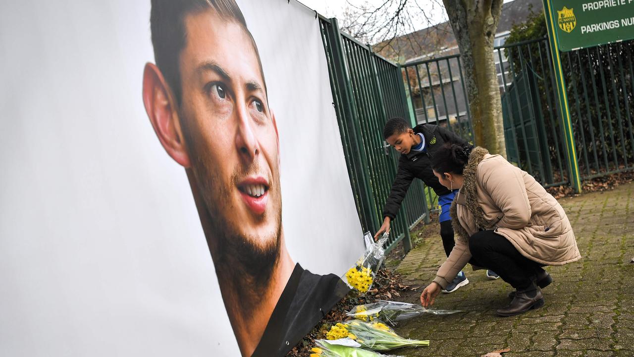 People put flowers in front of the entrance of the FC Nantes football club training center La Joneliere in La Chapelle-sur-Erdre.