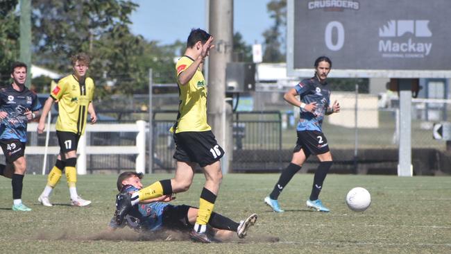 Bradley Whitworth slides in and picks up a yellow for the Mackay and Whitsundays Magpies Crusaders against Moreton Bay, July 18 2021. Picture: Matthew Forrest