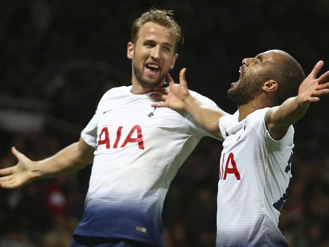 Tottenham Hotspur's Lucas Moura celebrates with Harry Kane scoring his side's third goal during the English Premier League soccer match between Manchester United and Tottenham Hotspur at Old Trafford stadium in Manchester, England, Monday, Aug. 27, 2018. (AP Photo/Dave Thompson)