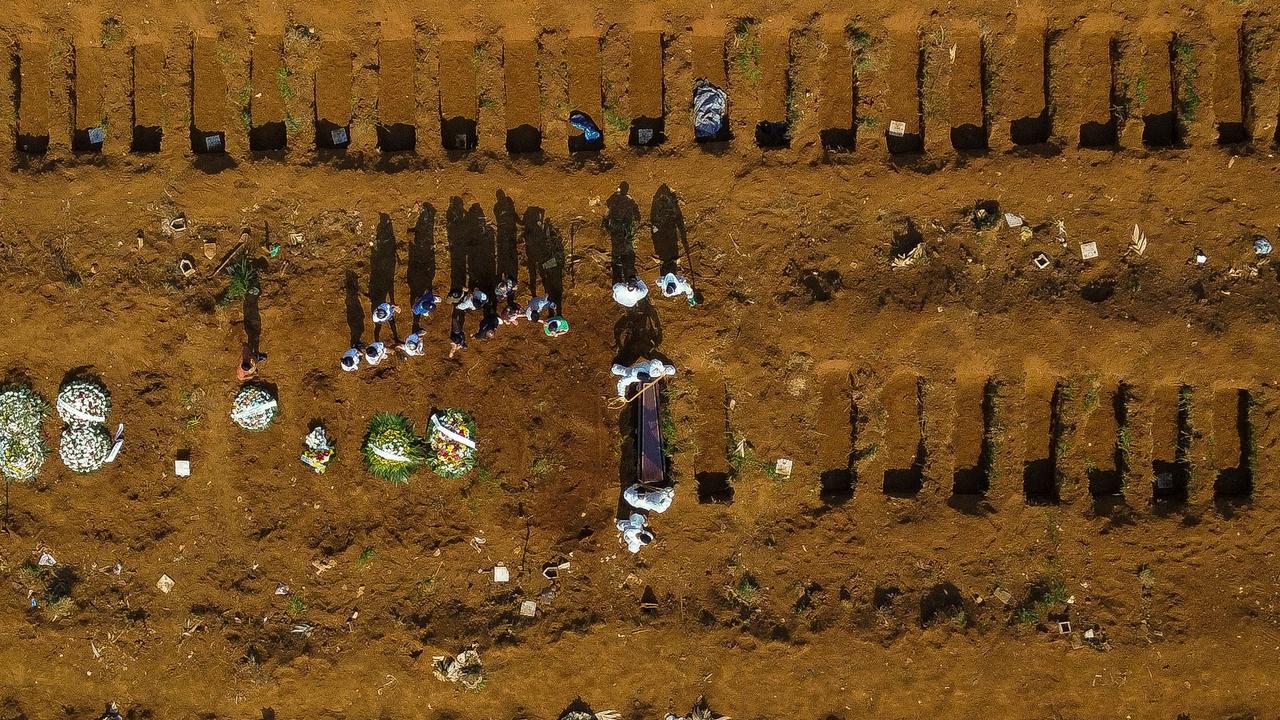 Aerial view of a burial at the Vila Formosa cemetery during the COVID-19 coronavirus pandemic, in Sao Paulo, Brazil, on March 23. Picture: Miguel Schincariol/AFP