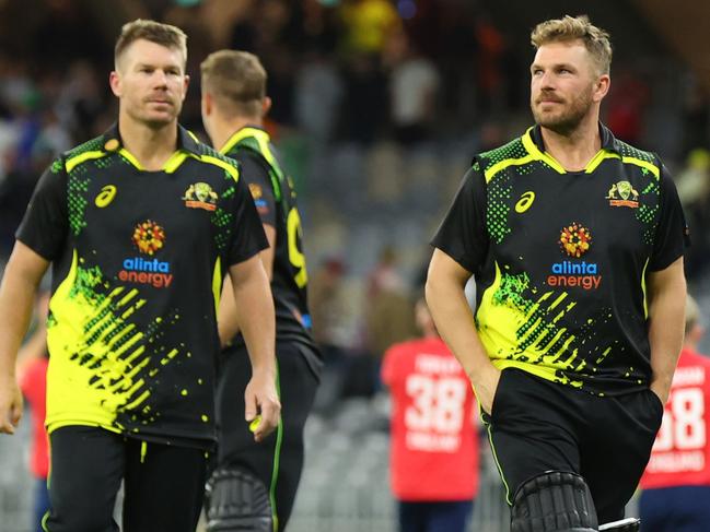 PERTH, AUSTRALIA - OCTOBER 09: Aaron Finch of Australia walks off the field after the loss during game one of the T20 International series between Australia and England at Optus Stadium on October 09, 2022 in Perth, Australia. (Photo by James Worsfold/Getty Images)