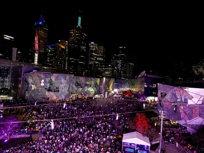 Federation Square and CBD crowds were organised and quiet early on. Picture: Nicole Cleary