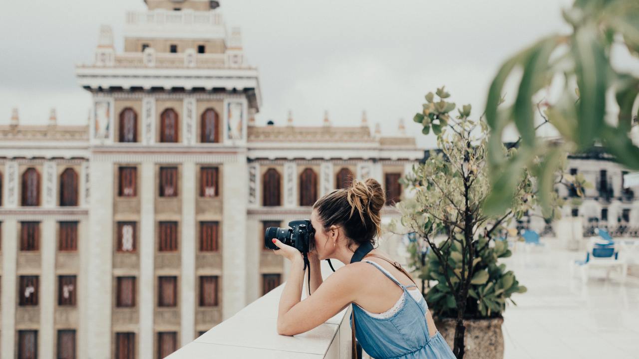 Girl taking photo. Picture: Persnickety Prints / Unsplash