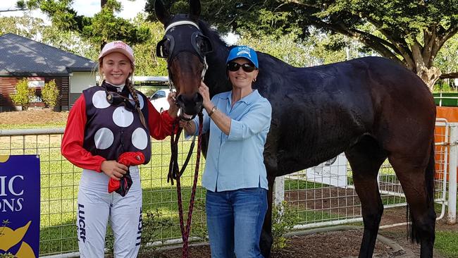 Winners of the fourth leg of the 2019 Magic Millions FNQ Up and Coming Stayers series, horse Run Hoof Run and jockey Rachel Shred with strapper.