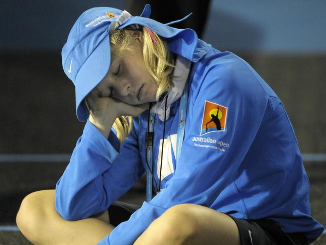 A ballgirl takes a nap during the 2008 epic. Picture: AFP/Paul Crock