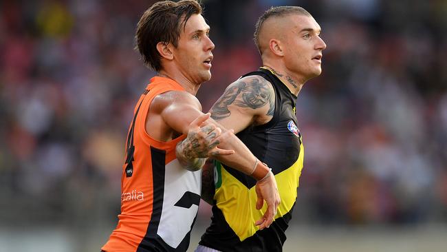 Matt de Boer of the Giants plays Dustin Martin closely.