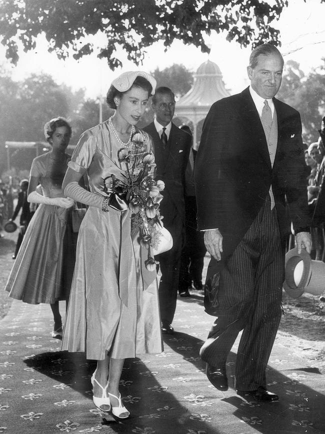 Queen Elizabeth walks with the Lord Mayor of Adelaide, Sir Arthur Rymill with Prince Philip and the Lord Mayor's daughter, Rosemary Rymill.
