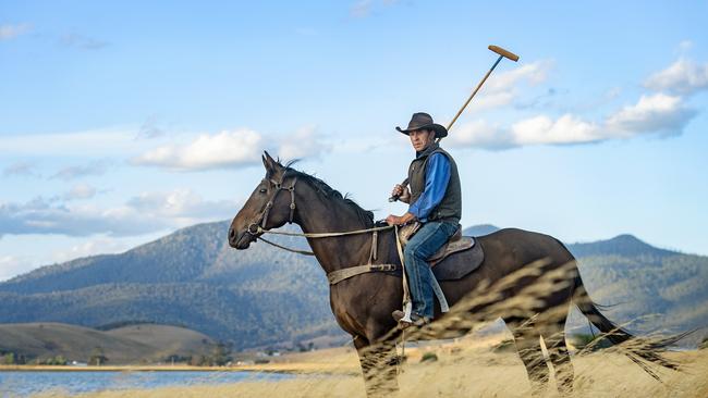 Craig Orchard riding his horse at sunset on Lake Omeo, ahead of the 34th Dinner Plain polo event at Cobungra Station over Easter weekend Picture: Zoe Phillips