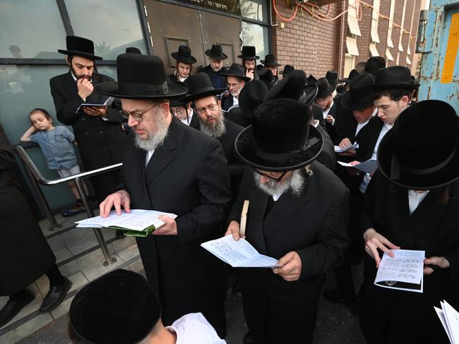 Mourners gather on Tuesday night. Picture: Tony Gough