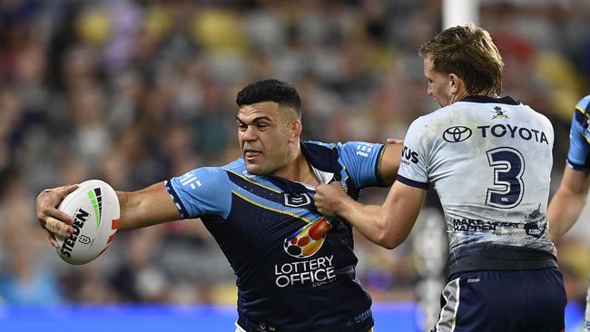 David Fifita of the Titans is tackled by Jaxon Purdue of the Cowboys during the round eight NRL match between North Queensland Cowboys and Gold Coast Titans at Queensland Country Bank Stadium, on April 26, 2025, in Townsville, Australia. (Photo by Ian Hitchcock/Getty Images)