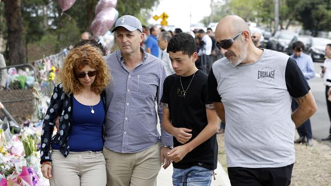 Bridget Sakr, her now husband Craig Mackenzie, Michael Sakr and Bob Sakr survey tributes after Veronique’s death. Picture: Jane Dempster