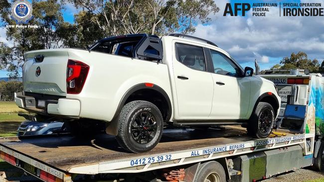 Criminal syndicates targeted under AFP-led Operation Ironside. Ute on the premise of a Cessnock place being towed away. $4.9 Million was found in a wall. Picture: AFP