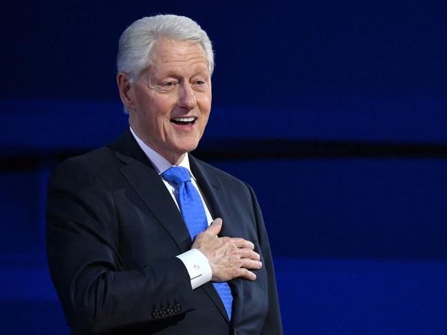 (FILES) Former US President Bill Clinton gestures as he arrives to speak on the third day of the Democratic National Convention (DNC) at the United Center in Chicago, Illinois, on August 21, 2024. Former US President Bill Clinton has been hospitalized with a fever, an aide to the former president announced on December 23, 2024. (Photo by Alex WROBLEWSKI / AFP)