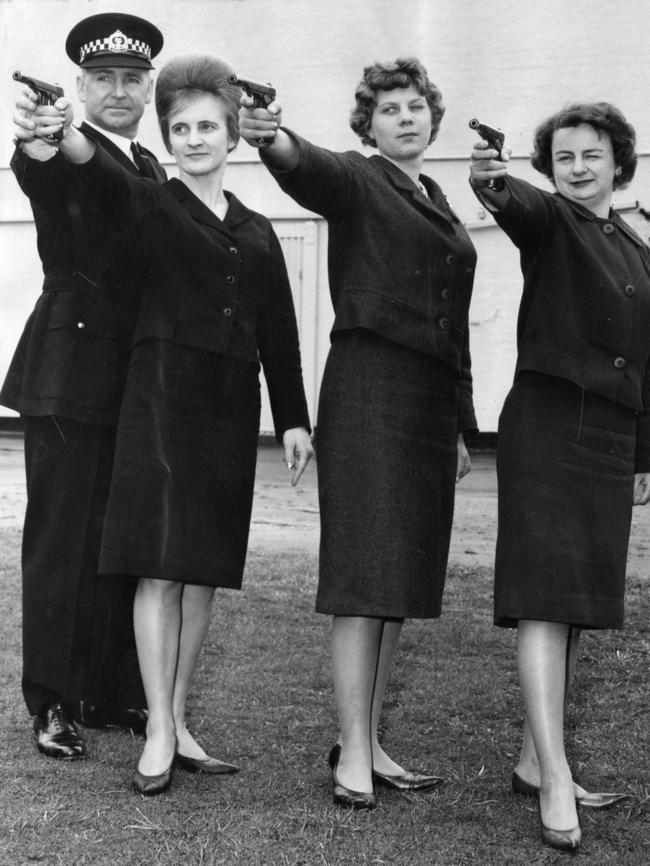 1963: Probationary constables Fay Leditschke, Dorothy Griffiths and Margaret Neale, aim guns while receiving a lesson in marksmanship from Inspector H. C. Bottroff at the Thebarton Police Training College in South Australia. Picture: Vern Thompson/File