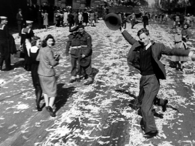 Two women turn and smile at the Dancing Man’s jubilant display. Picture: Supplied