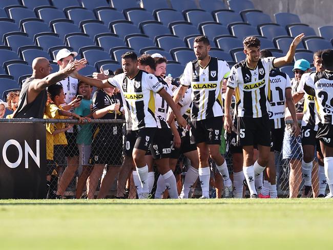 Macarthur players celebrate with fans after Jake McGing’s match-winning goal. Picture: Mark Kolbe/Getty Images