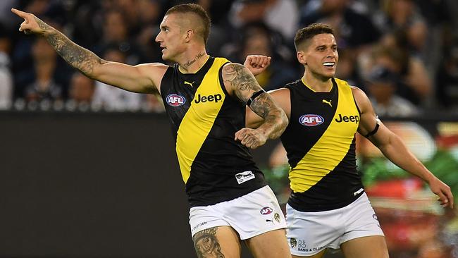 Dustin Martin celebrates one of his four goals with new teammate Dion Prestia.