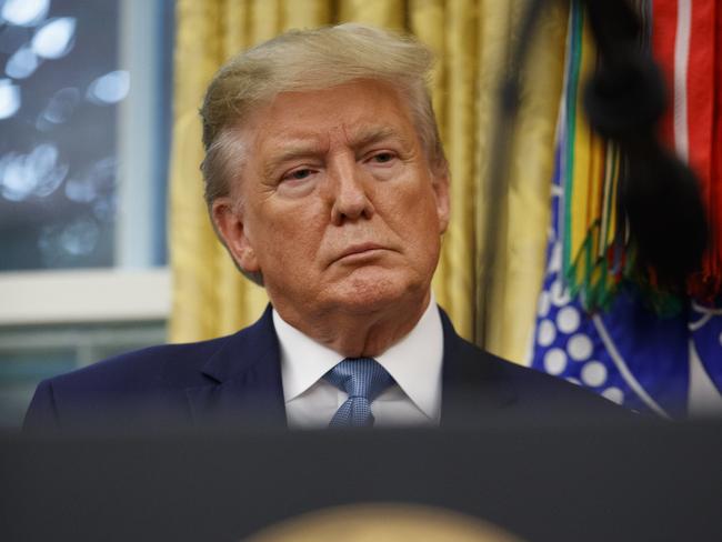 President Donald Trump stands during a ceremony to present the Presidential Medal of Freedom to former Attorney General Edwin Meese, in the Oval Office of the White House, Tuesday, Oct. 8, 2019, in Washington. (AP Photo/Alex Brandon)