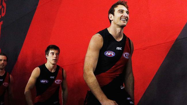 Jobe Watson leads Essendon out.