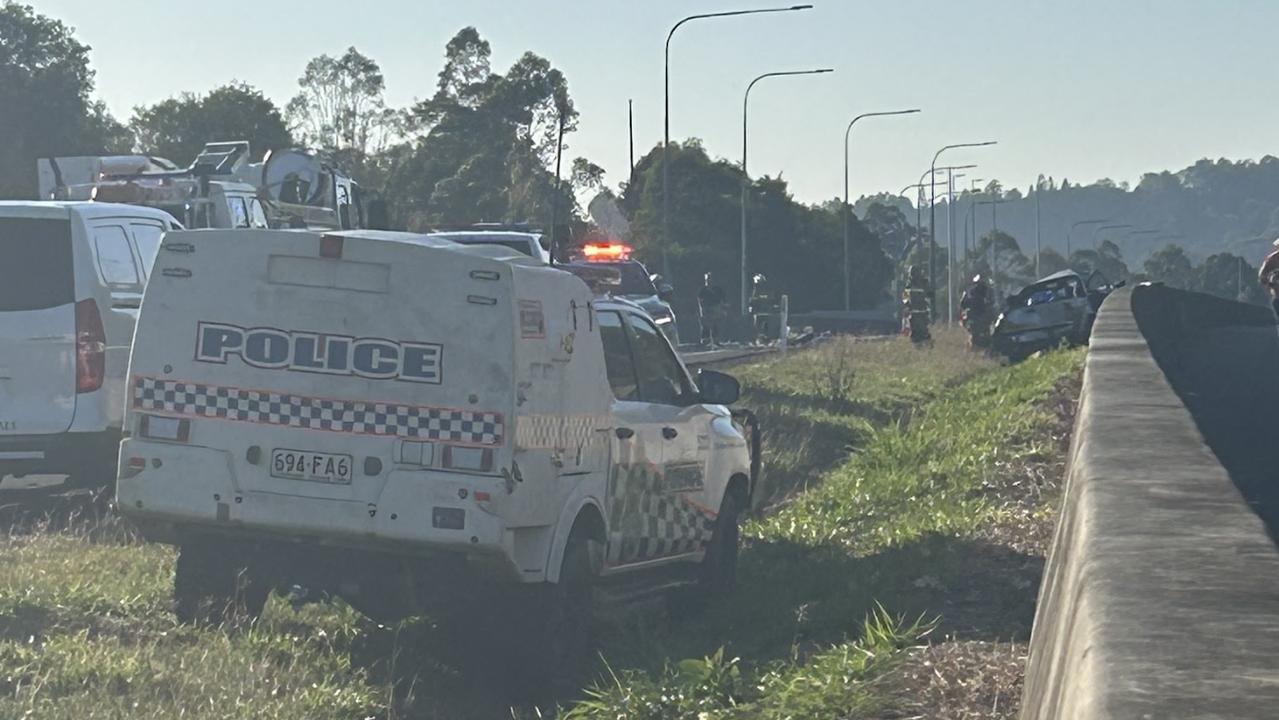 Police investigate at the scene of a triple fatality on the Bruce Highway at Federal. Photo: Chelsea Heaney.