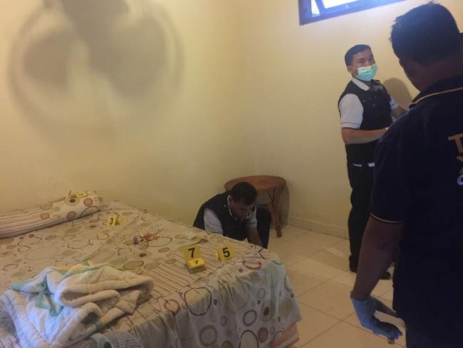 Forensic police search room three of the Kubu Kauh Beach Inn at Kuta for clues — the room is where the couple stayed. In this room they found blood stains. Picture: Supplied