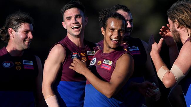 Banyule players celebrate a win. Picture: Andy Brownbill