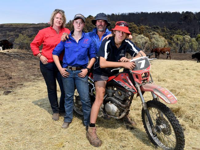 CUDLEE CREEK FIRE - WOODSIDE CATTLE FARMERS. Julia Waddington-Powell and husband Lincoln Powell with children Georgia 16 and Charlie 15 and the remaining cows they have after the fires devastated the land in Woodside where they graze their cattle. Picture: Tricia Watksinon