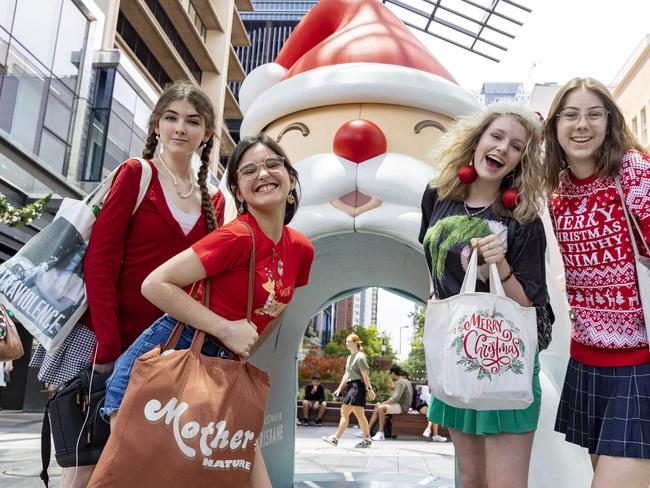 BRISBANE AUSTRALIA - NewsWire Photos DECEMBER 23, 2022: Friends (left to right) Ashlee Palmer, Phoebe Sultana, Neve Francis and Brydi-Rose Peters in the Queen Street Mall. The mall is busy with shoppers 2 days before Christmas.  NewsWire / Sarah Marshall