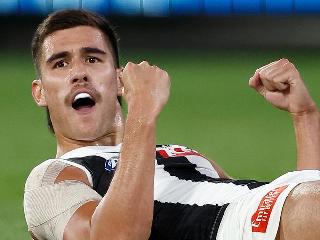 MELBOURNE, AUSTRALIA - MARCH 21: Reef McInnes of the Magpies celebrates a goal during the 2024 AFL Round 02 match between the St Kilda Saints and the Collingwood Magpies at the Melbourne Cricket Ground on March 21, 2024 in Melbourne, Australia. (Photo by Michael Willson/AFL Photos via Getty Images)